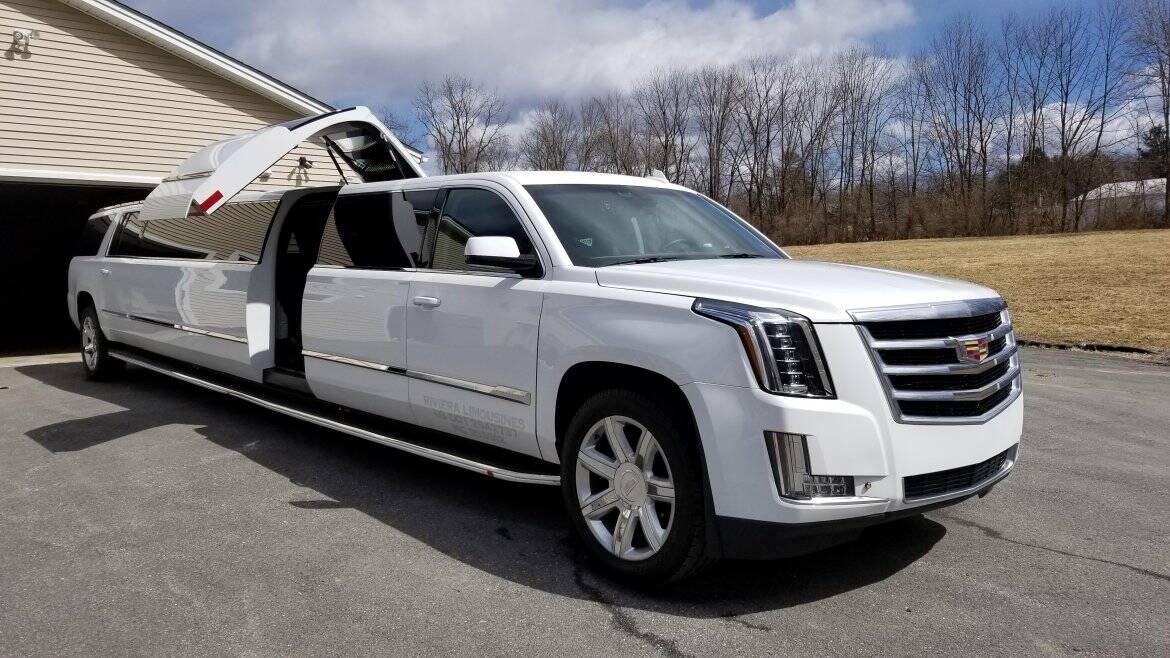 Cadillac Escalade stretch limousine with jet door open — Moonlight Limo serving Clifton NJ
