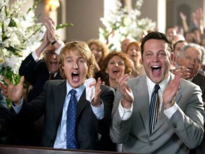 men clapping at a wedding