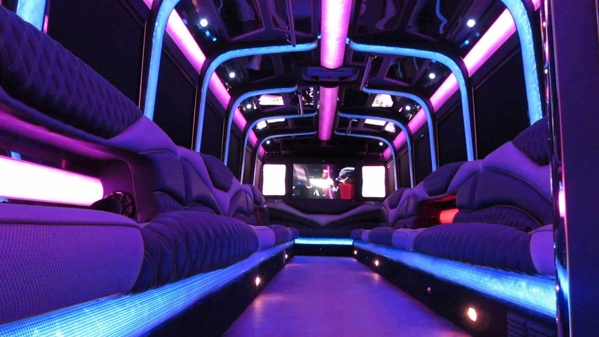 Interior of large Moonlight Limo party bus with purple LED lighting — party bus rental Hackensack NJ Bergen County