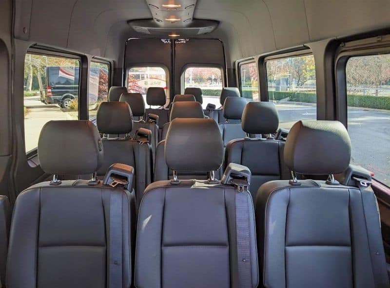 14-passenger wedding shuttle interior NJ — leather seats, USB charging, and WiFi for wedding guests